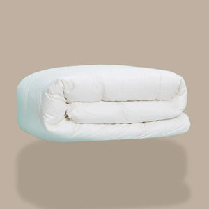 A white down duvet, rolled