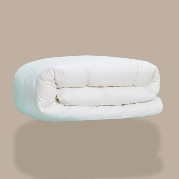 A white down duvet, rolled