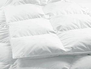 Close view of baffle-box stitching on a white down duvet