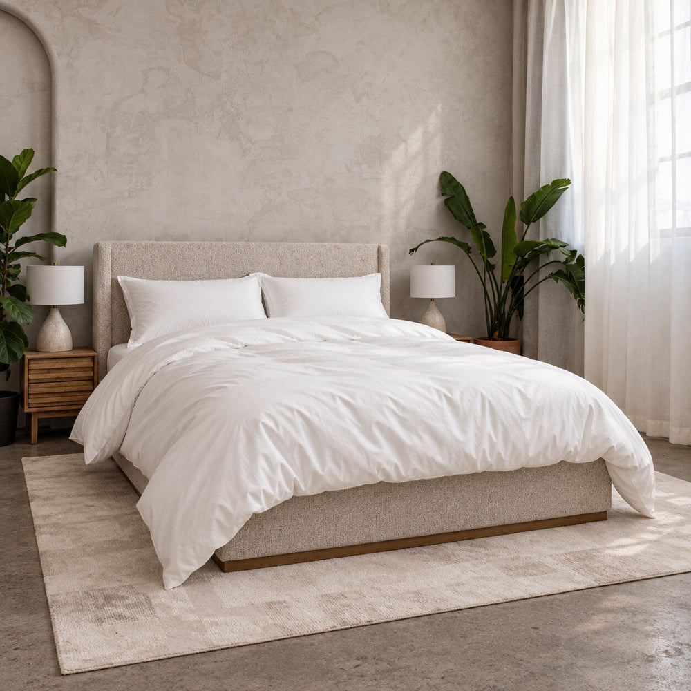 The Cloud Sleep Set made up on a bed with both pillows