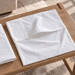 The envelope closure of an empty Cloud Pillowcase, its inner flap turned back where the pillow tucks in