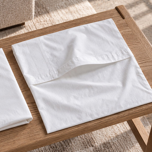 The envelope closure of an empty Cloud Pillowcase, its inner flap turned back where the pillow tucks in