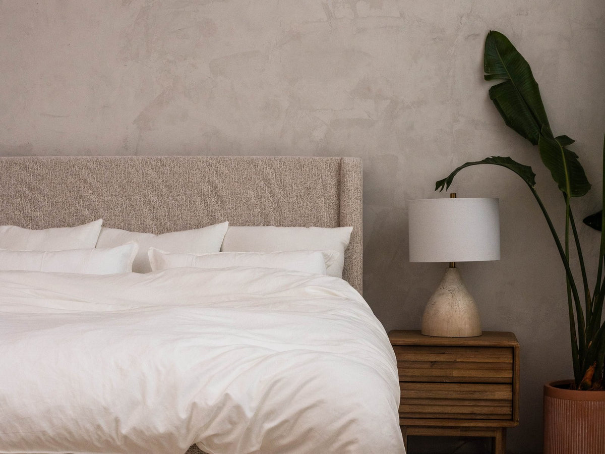 The same bed made with a fluffy cloud duvet