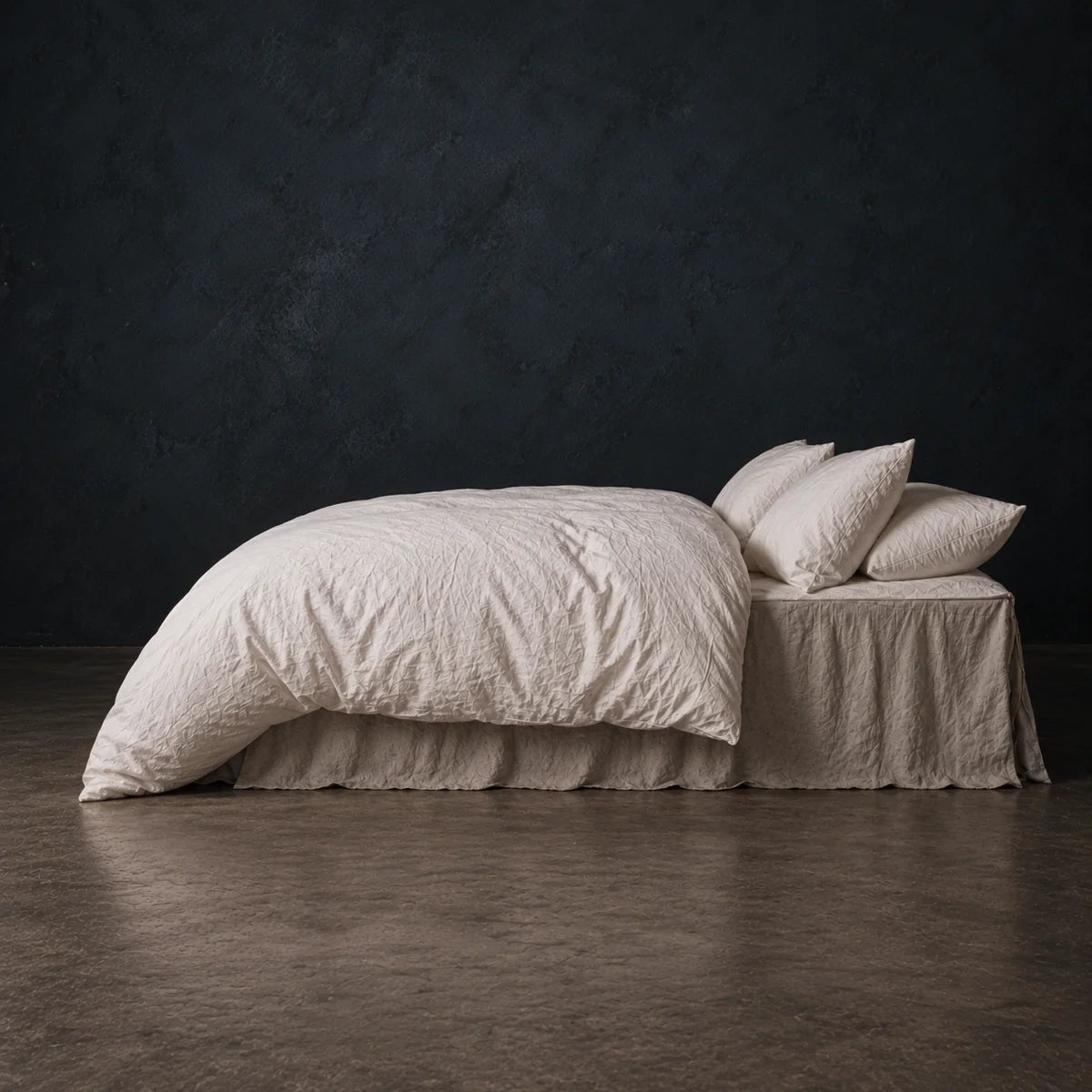 Cloud Heaven Duvet falling in deep folds over the side of a bed.